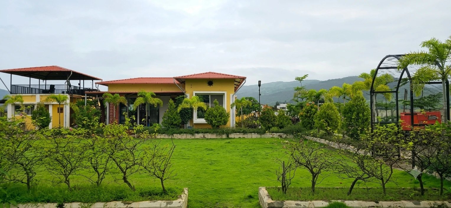 Green lawns and the farmhouse under open sky