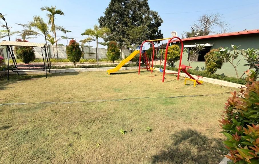 Kids play area with swings and slide